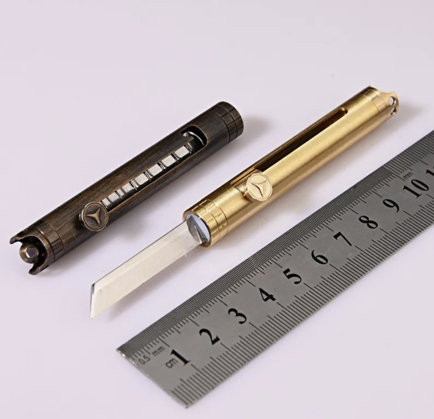 AUTO RETRACTING UTILITY POCKET RAZOR POLISHED BRASS – LIGHTNING OTF KNIVES