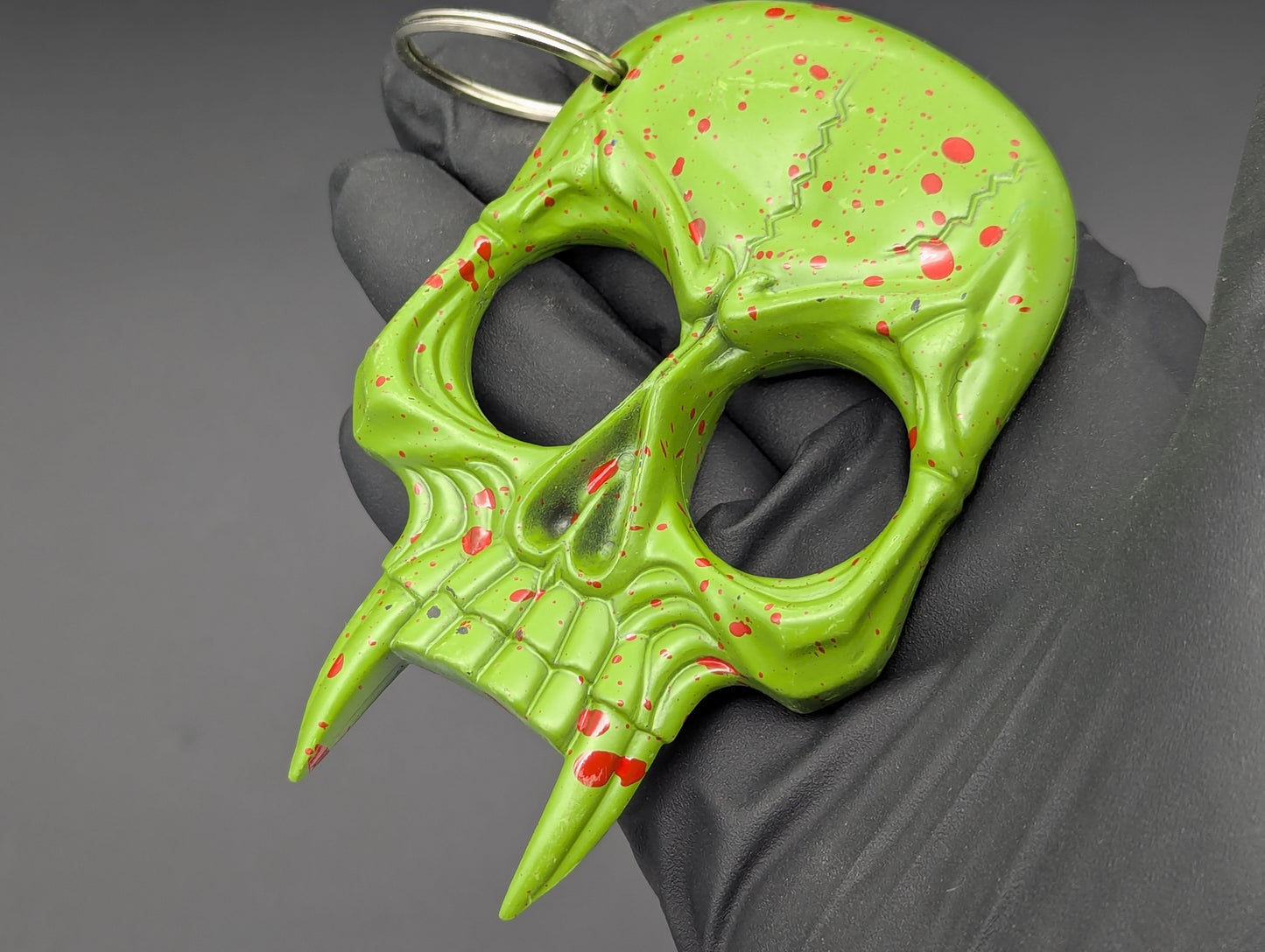 ZOMBIE SKULL SELF DEFENSE KEYRING GREEN RED SPLAT