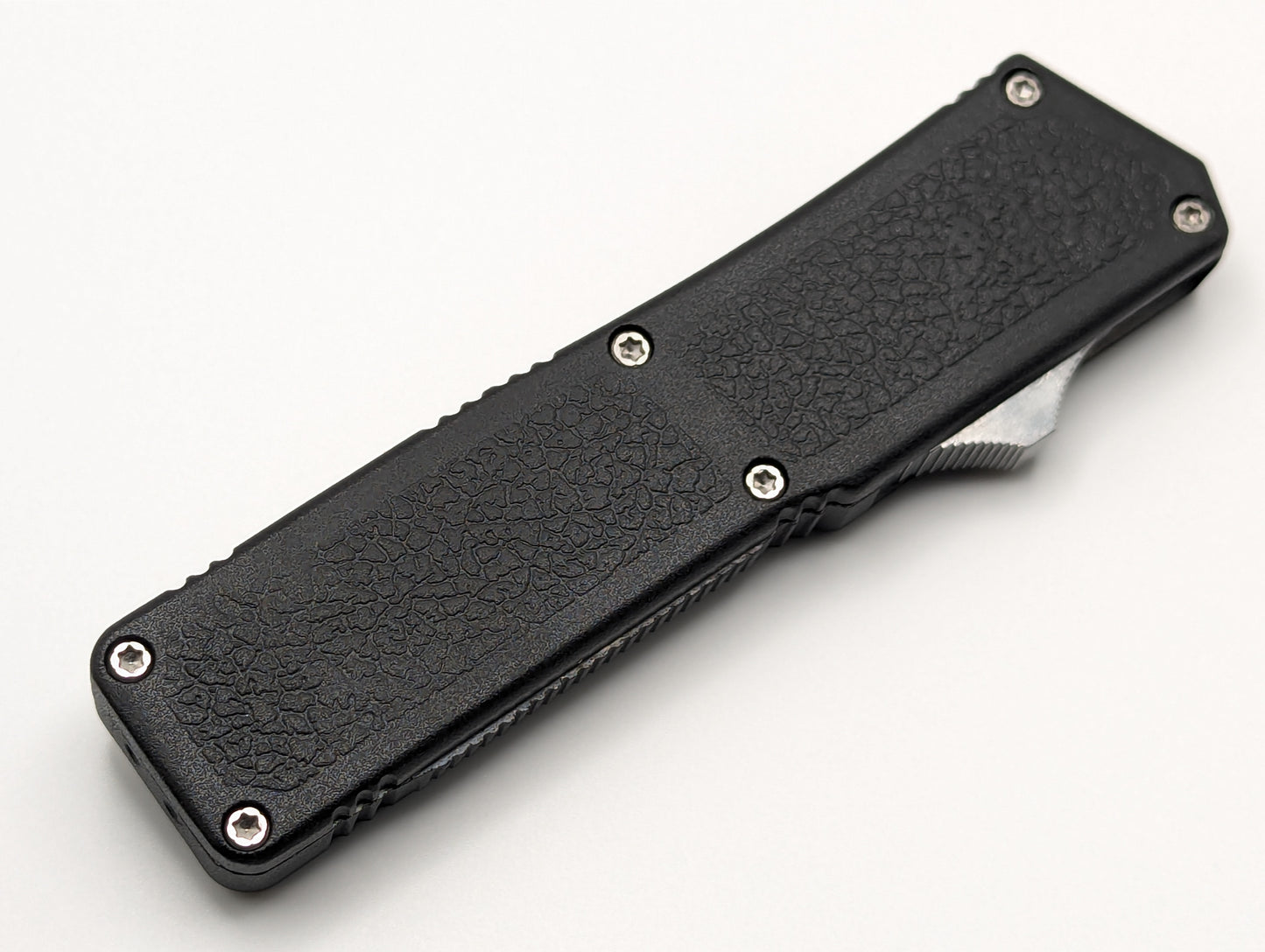 Black Part Serr. Clip Point Lightning OTF Knife