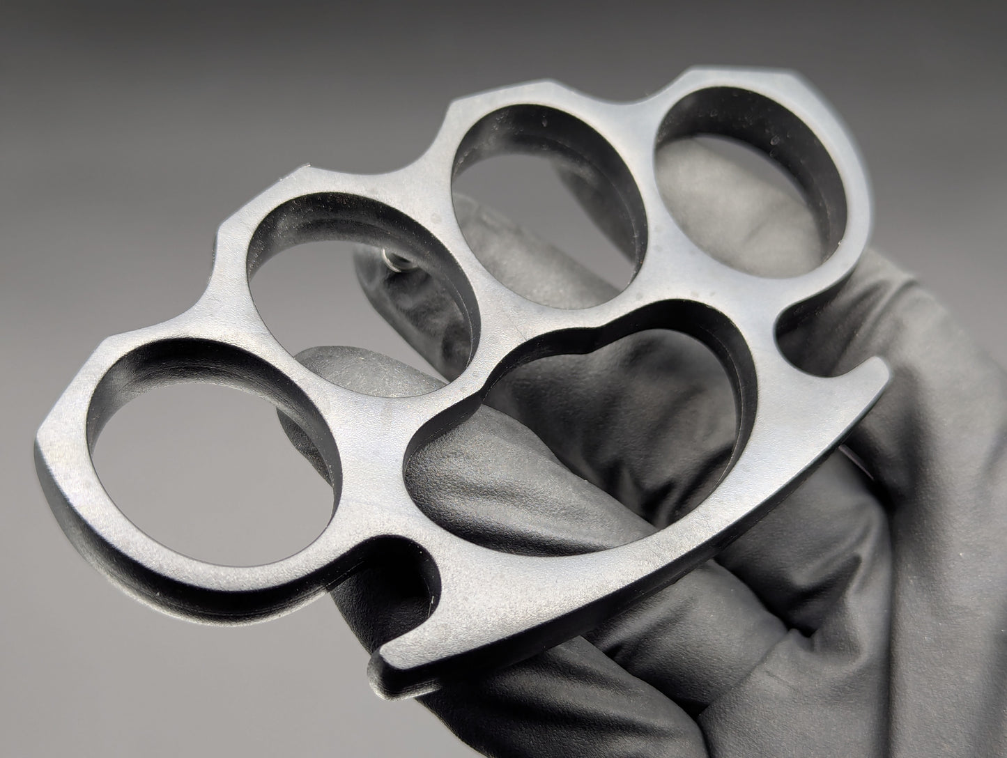 ABS PLASTIC NON PERMISSIVE ENVIRONMENT KNUCKLE DUSTERS BLACK