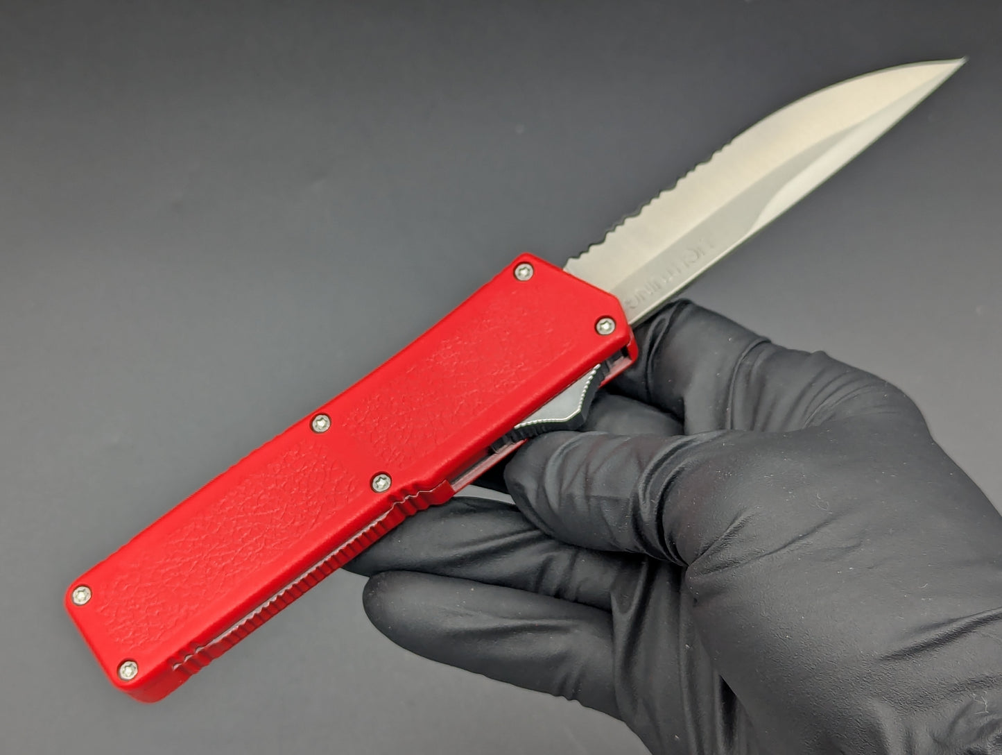 Lightning OTF Knife Red Part Serr. Drop Point