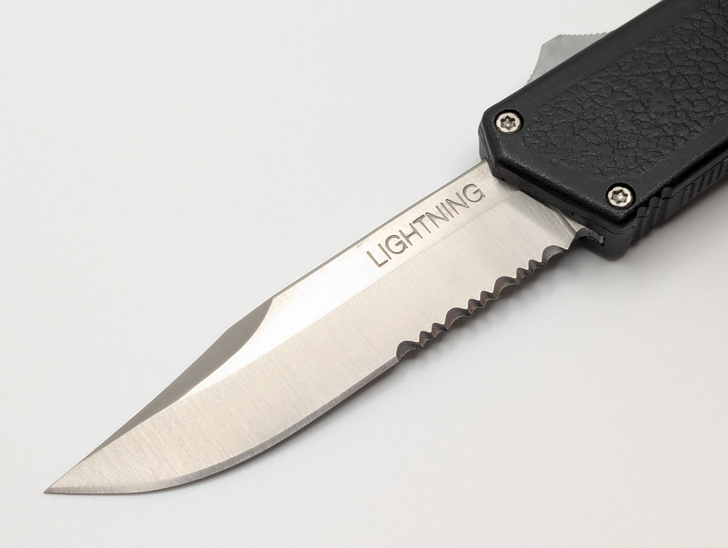 Black Part Serr. Clip Point Lightning OTF Knife