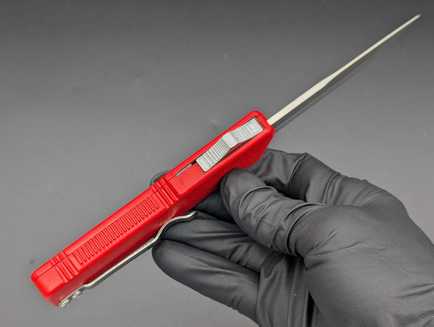 Lightning OTF Knife Red Part Serr. Drop Point